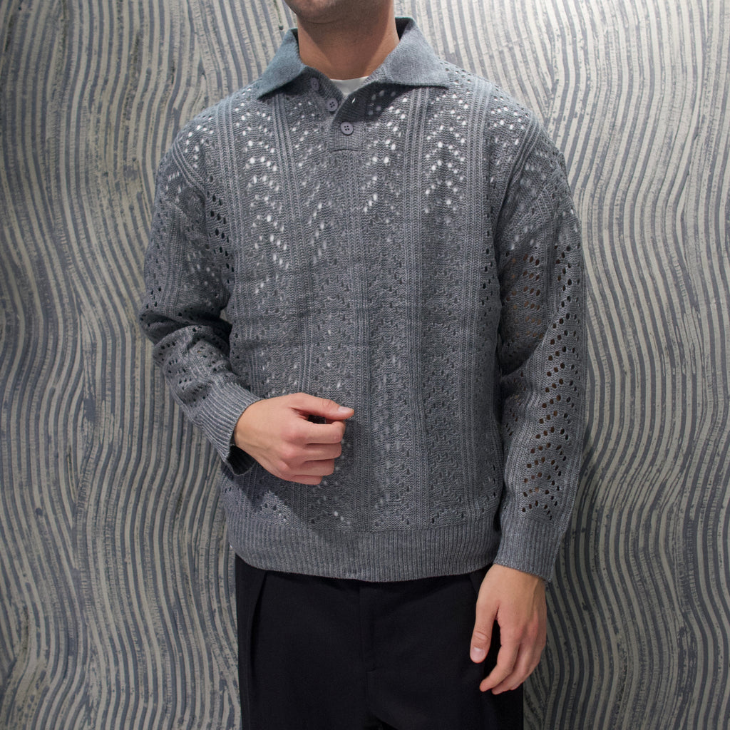 Polo traforata grigia