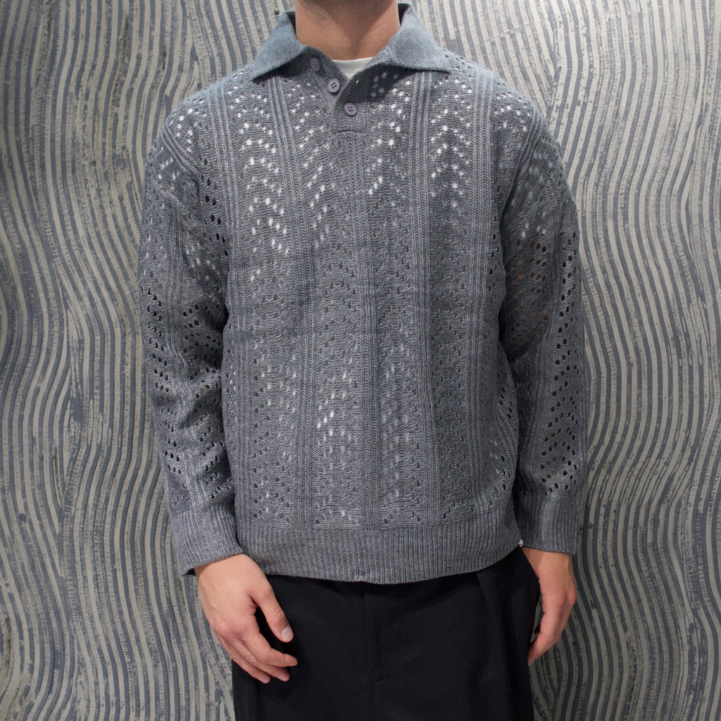 Polo traforata grigia