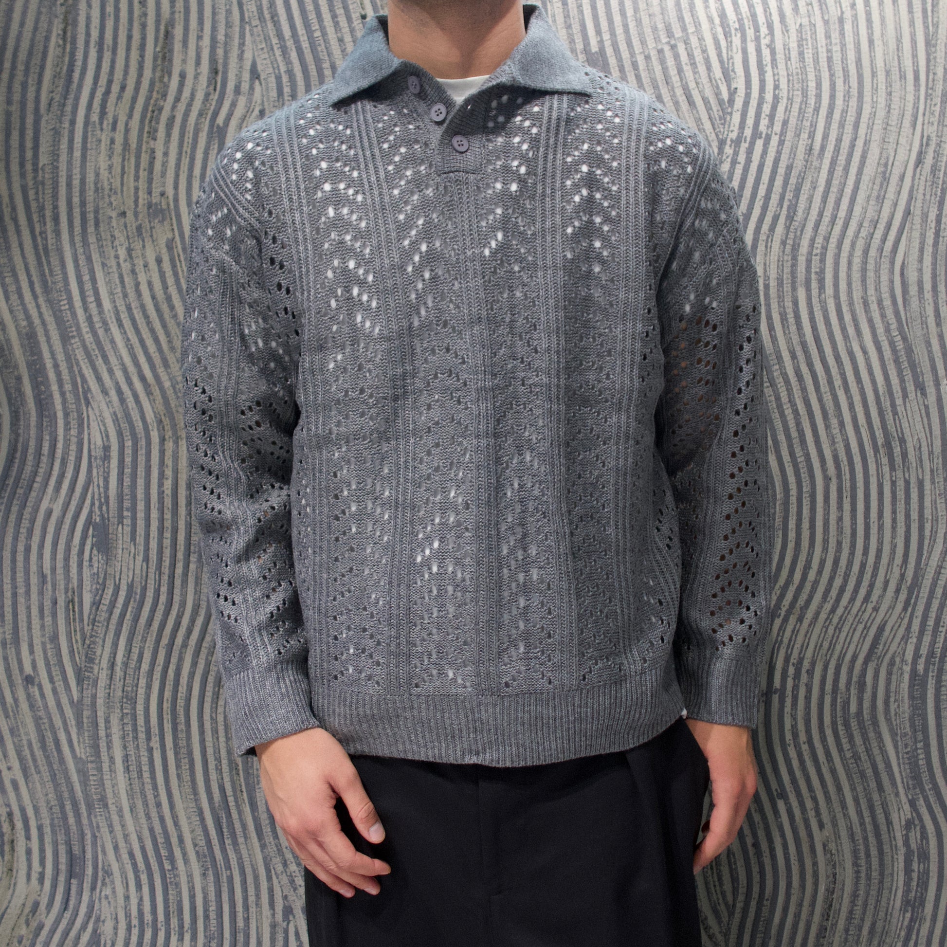 Polo traforata grigia