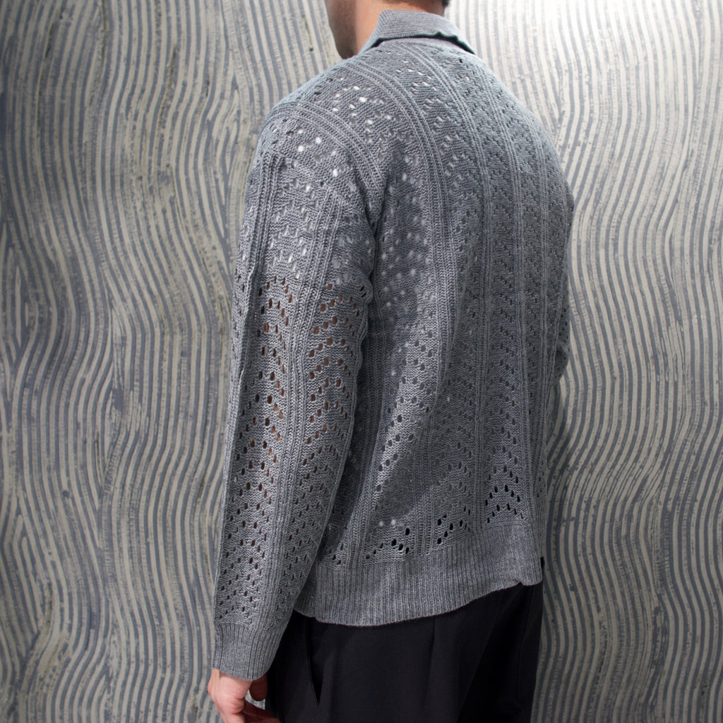 Polo traforata grigia